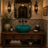 Talavera vessel sink round teal modern Mexican bathroom featured in a restaurant restroom with refined decor