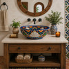 Talavera vessel sink round blue arch floral design displayed on bathroom vanity with natural light and clean countertop styling