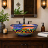 Talavera vessel sink round floral geometric design in bathroom vanity with natural light and handcrafted Mexican ceramic detail
