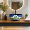 Talavera vessel sink round floral lattice design in a modern bathroom vanity with clean lines and window light