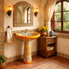 Orange Talavera pedestal sink with floral scrollwork in a bathroom