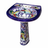 Cobalt blue Talavera bathroom pedestal sink with floral scroll pattern, angled view