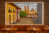 Mexican tile mural with village featured in a restaurant wall setting with vibrant colonial town