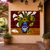 Mexican tile mural with sunflowers and calla lilies in blue vase on a hacienda patio.