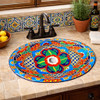 Oval talavera floral geometric mexican bathroom sink installed in Mediterranean kitchen with stone countertop and tile backsplash