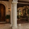 Mexican hacienda cantera column with tapered entasis inside an elegant luxury hacienda home