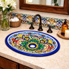 Talavera multicolor scroll bathroom sink displayed in a house bathroom as a vibrant handcrafted focal point