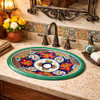 Cobalt multicolor talavera bathroom sink installed in a Spanish Revival house bathroom with artisan accents