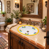 Mexican oval bathroom sink yellow tulip design in colonial powder room with carved wood