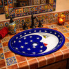 Oval mexican bathroom sink cobalt moon design featured in Mexican restaurant restroom with colorful tile decor