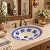 Oval Mexican bathroom sink cobalt bird design in a modern hacienda retreat with natural wood