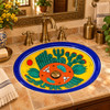 Oval Mexican bathroom sink desert cactus design in a vintage brass bath with carved wood details