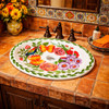 Oval mexican talavera hummingbird floral bathroom sink featured in a Mexican restaurant restroom with colorful decor