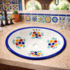 Oval talavera floral cobalt mexican bathroom sink set into a Mediterranean kitchen bar with tiled backsplash
