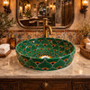 Talavera above counter round drop in vessel sink in restaurant restroom elegant setting