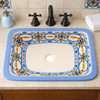 Rectangular talavera bathroom sink blue geometric pattern design installed in traditional house bathroom with wood vanity