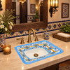 Rectangular talavera bathroom sink blue geometric pattern design featured in restaurant bathroom with artisan decor