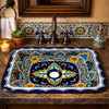 Rectangular talavera bathroom sink intricate floral geometric design in Spanish Revival bathroom with tile accents
