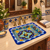 Rectangular talavera bathroom sink intricate floral geometric design installed in traditional house bathroom vanity setting