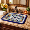 Rectangular talavera bathroom sink blue floral design installed in traditional house bathroom with wood vanity
