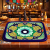 Rectangular talavera bathroom sink with blue yellow flor design in restaurant interior creating vibrant focal point with colorful Mexican decor