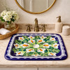 Rectangular talavera bathroom sink white calla lily design in powder room with soft lighting