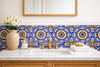 Cobalt medallion talavera tile used in a bathroom vanity wall with clean white grout lines