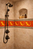 Talavera lizard silhouette tile featured in a bathroom shower with evenly spaced four inch tiles and clear grout joints