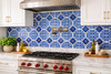 Talavera blue medallion tile installed as kitchen backsplash with solid colors and crisp pattern definition