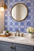 Blue medallion talavera tile installed on a bathroom wall creating a refined traditional and artisanal look
