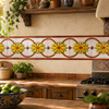 Mexican yellow flor over white relief border talavera tile in a colorful Mexican kitchen