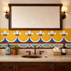 Talavera fleur de lis geometric relief border tile framing bathroom vanity wall in colonial style