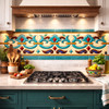 Talavera fleur scroll relief border mexican tile installed as kitchen backsplash accent band
