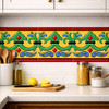 Mexican Talavera relief border golden yellow background tile installed as kitchen backsplash decorative border