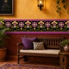 Mexican talavera black floral relief border tile in a boutique hotel with warm rustic decor