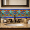 Handcrafted talavera mexican floral scroll relief tile framing bathroom vanity wall detail