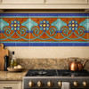 Handcrafted talavera mexican floral scroll relief tile installed as kitchen backsplash trim