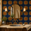 Mexican relief tile with a sun face motif installed in bathroom accent wall with terracotta details