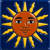 Mexican relief tile with a sun face motif