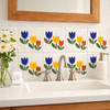 Talavera three tulip mexican tile used behind a bathroom vanity creating a warm handcrafted accent