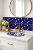 Talavera five star mexican tile placed behind a bathroom vanity adding contrast and traditional charm