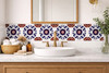 Talavera tile geometric flower corner applied behind a bathroom vanity adding symmetry and handcrafted character