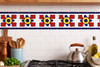 Talavera tile petal medallion decorative border design used as a kitchen backsplash accent with handcrafted character