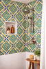 Diagonal floral border talavera tile featured in a bathroom shower with balanced color contrast