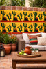 Cactus desert folk talavera tile applied on patio wall enhancing outdoor space with Mexican folk character