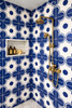 Cobalt geometric medallion talavera tile covering a bathroom shower wall with rhythmic geometry and solid color depth