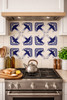 Cobalt bird talavera tile installed as a kitchen backsplash adding bold cobalt contrast and artisan character