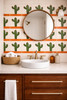 Green cactus mexican tile design accenting bathroom vanity wall with solid colors and graphic clarity