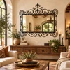 Wrought iron framed mirror – Spanish colonial design displayed in a rustic living room