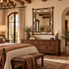 Spanish mission style wrought iron wall mirror displayed in a hacienda-style bedroom